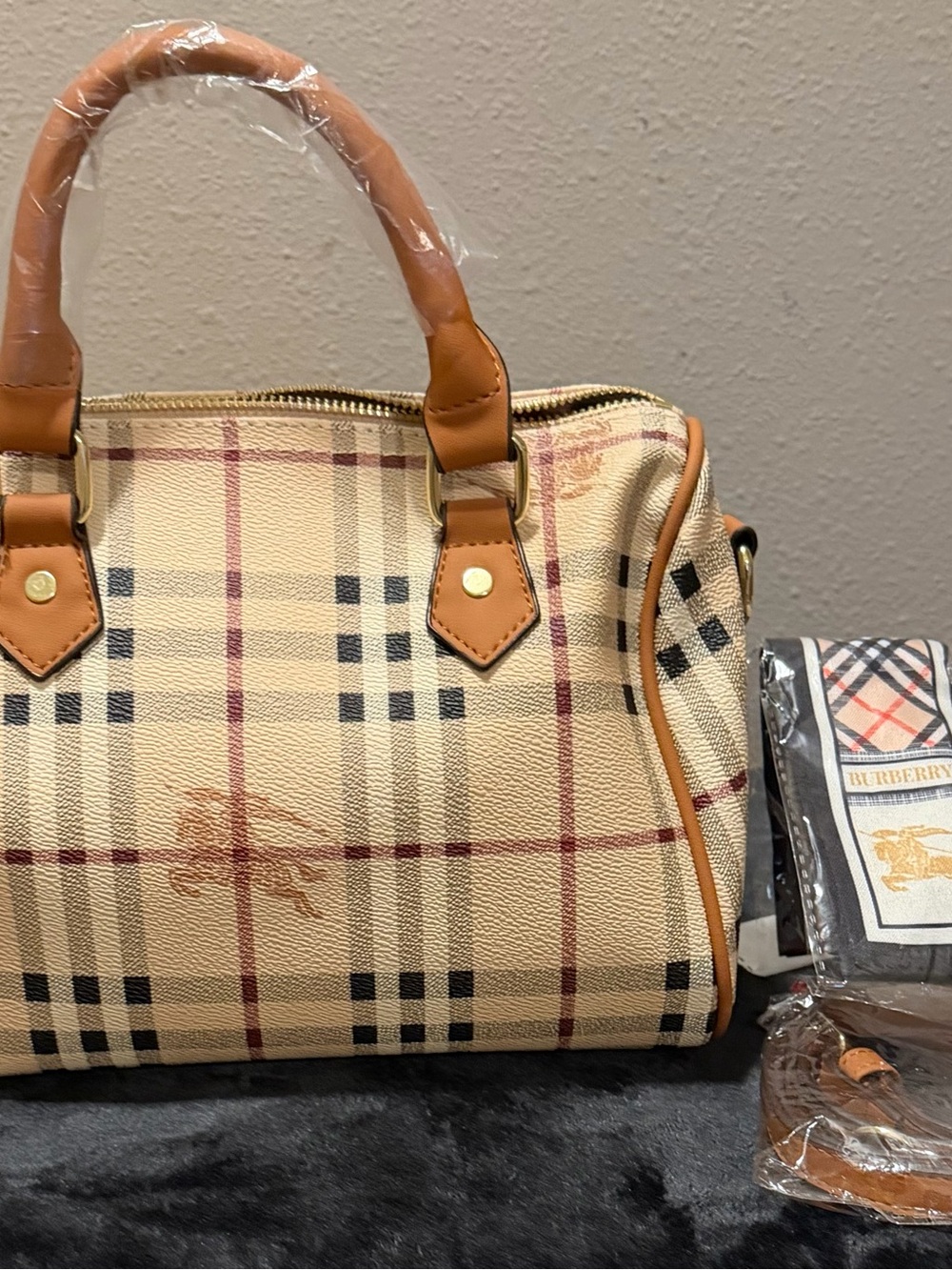 Burberry handbag with twilly and small strap.